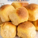 Rolls piled on a wooden board.
