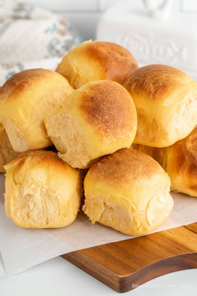 Dinner rolls on a wooden board. 