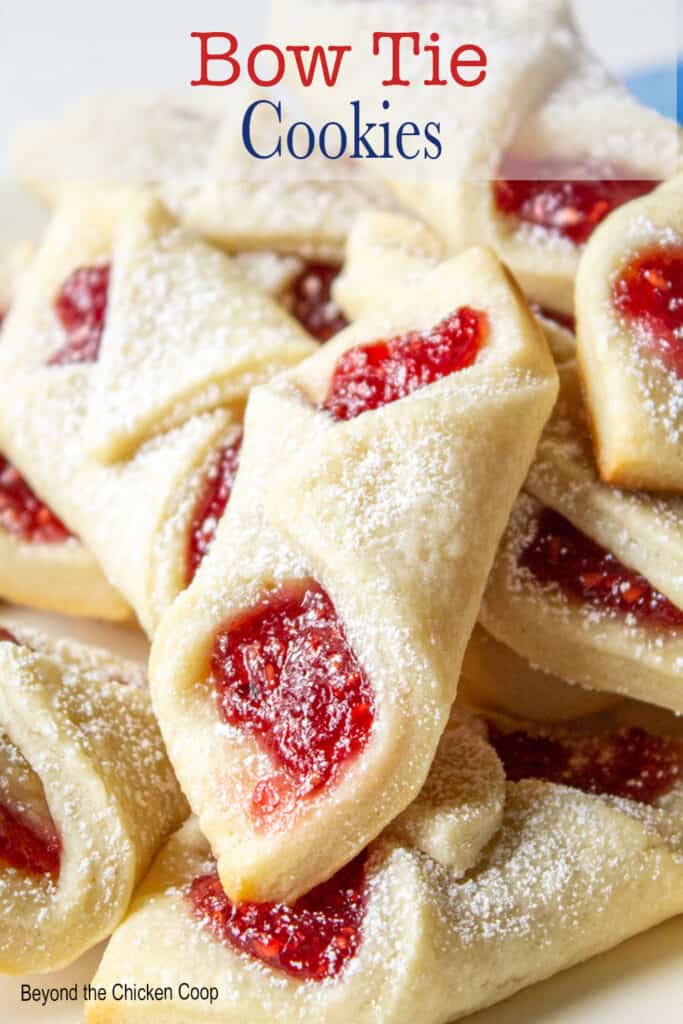 Raspberry filled cookies topped with powdered sugar.