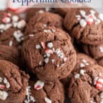 Round chocolate cookies with broken candy cane pieces.