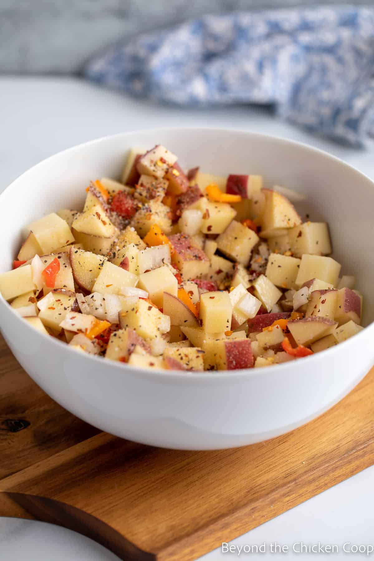 Cubed potatoes sprinkled with seasonings.