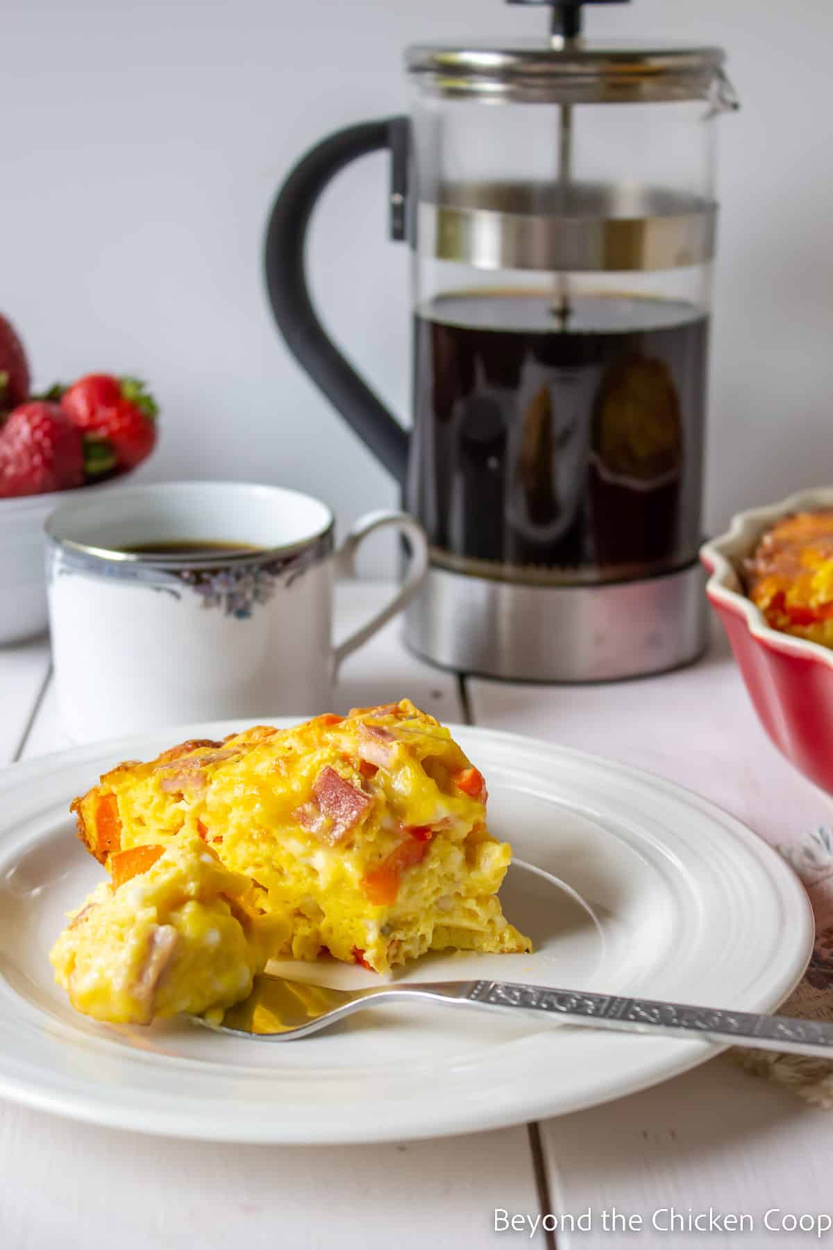 An egg casserole on a white plate. 