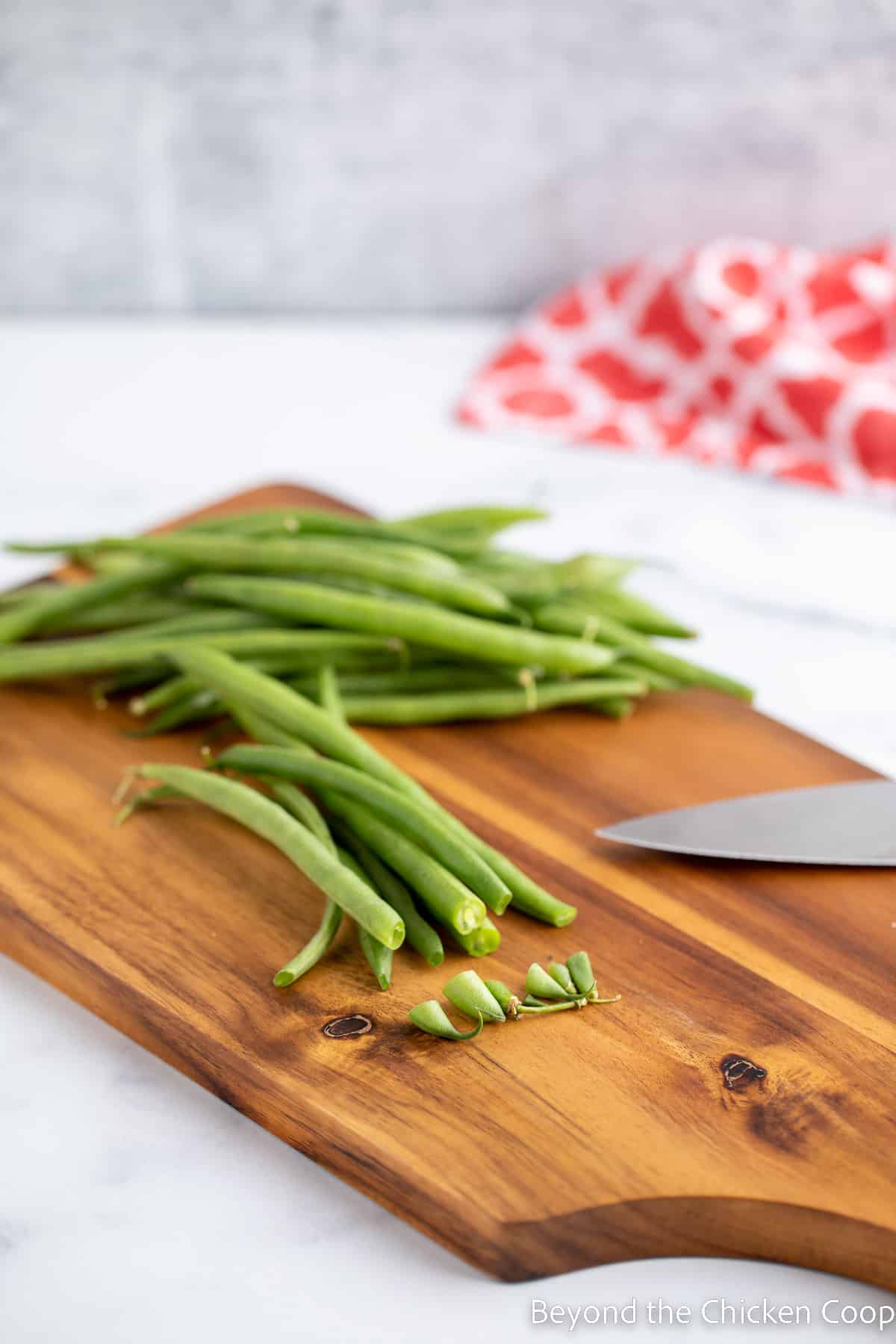 Trimming the ends off of green beans.