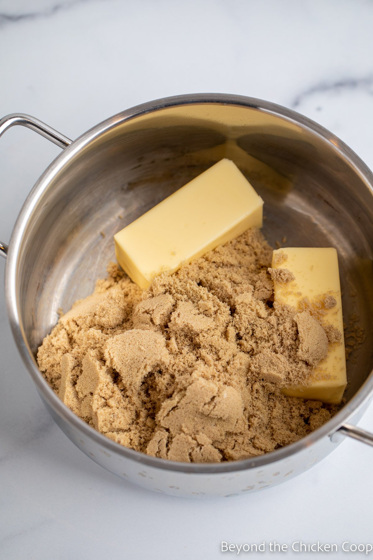 Butter and brown sugar in a saucepan.