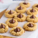 Peanut butter cookies with chocolate kisses in the center of each cookie.