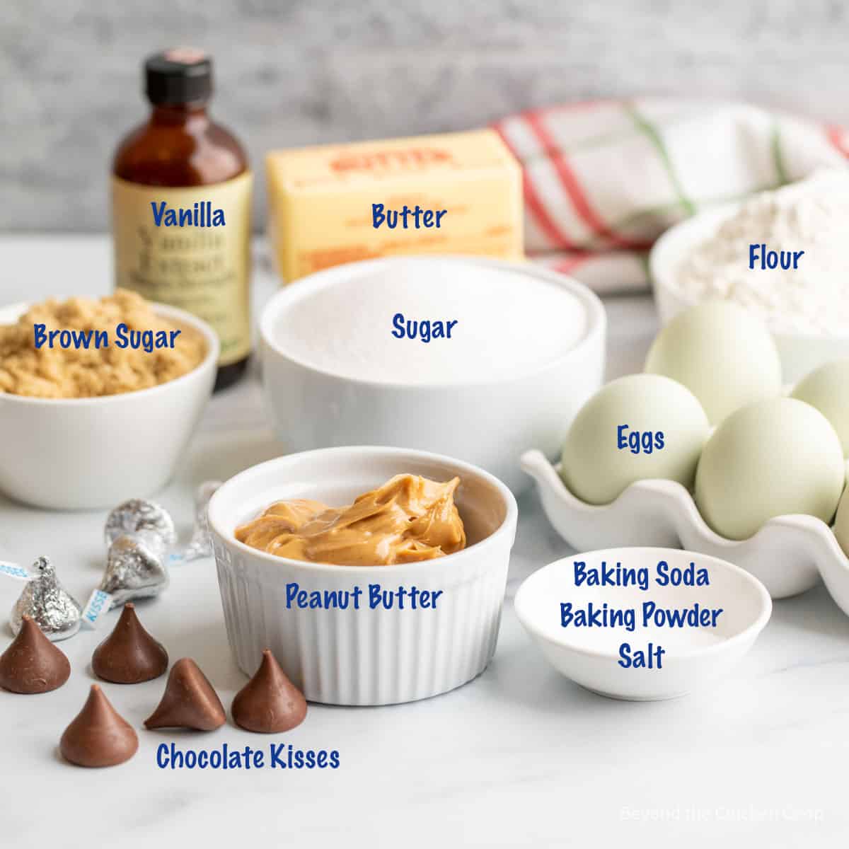 Ingredients for making peanut butter cookies with chocolate kisses. 