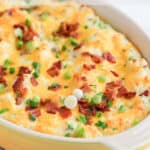 Potato casserole in a yellow dish.