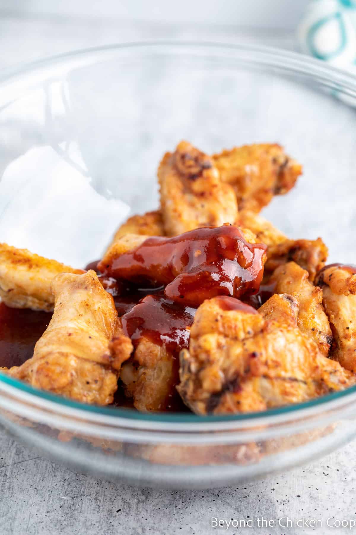 Wings covered with BBQ sauce. 