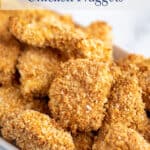 Small pieces of chicken coated in breadcrumbs.