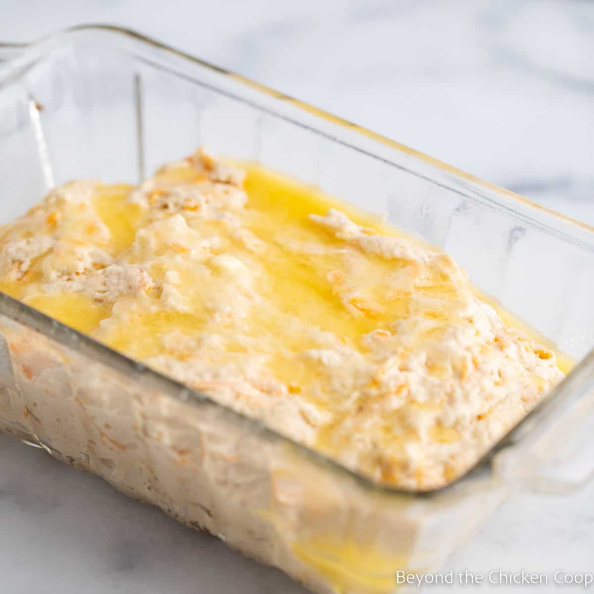 Beer bread batter in a loaf pan. 