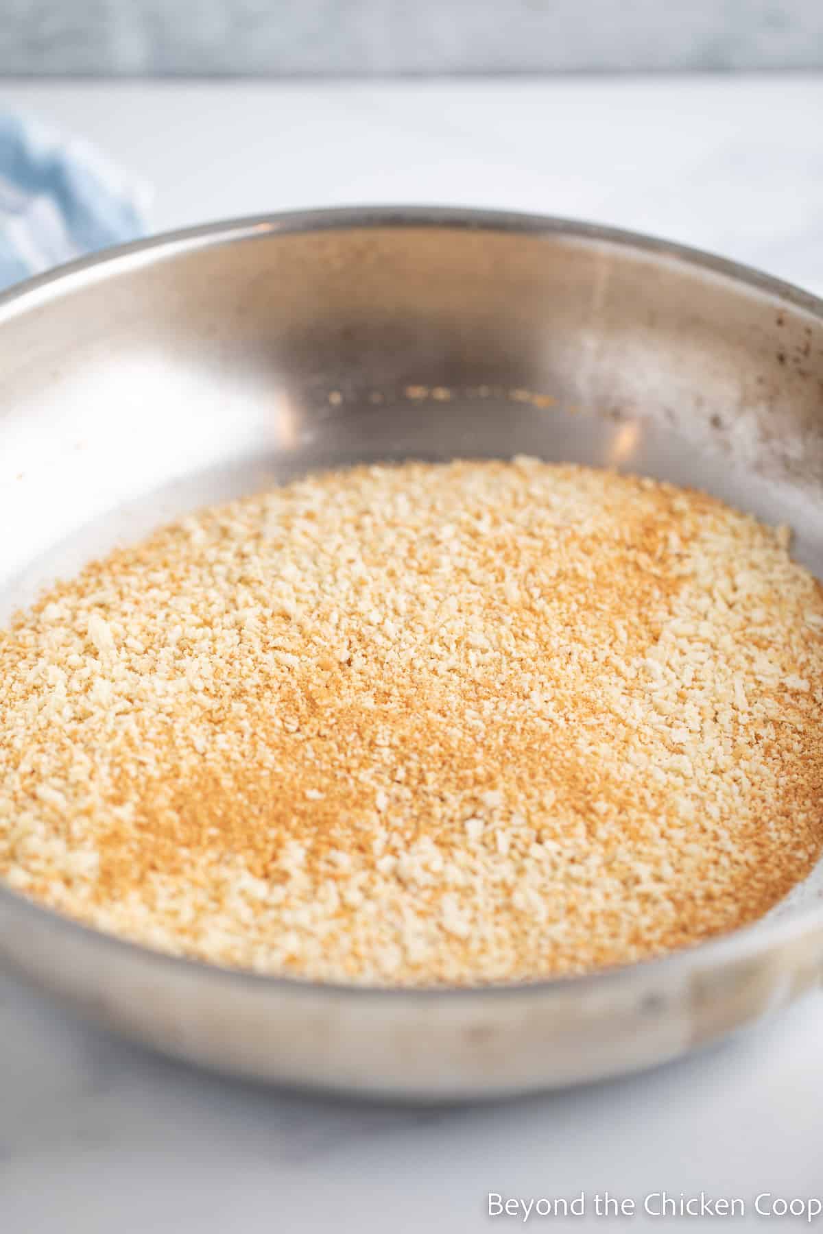 Toasted breadcrumbs in a skillet. 