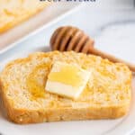 A slice of bread topped with butter and honey.