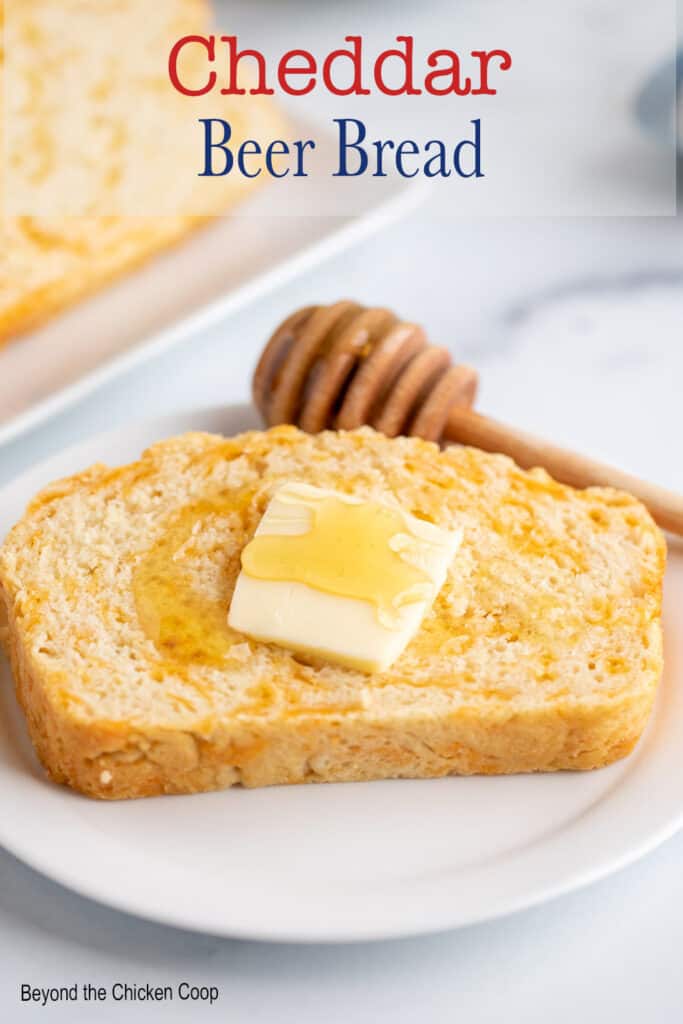 A slice of bread topped with butter and honey.