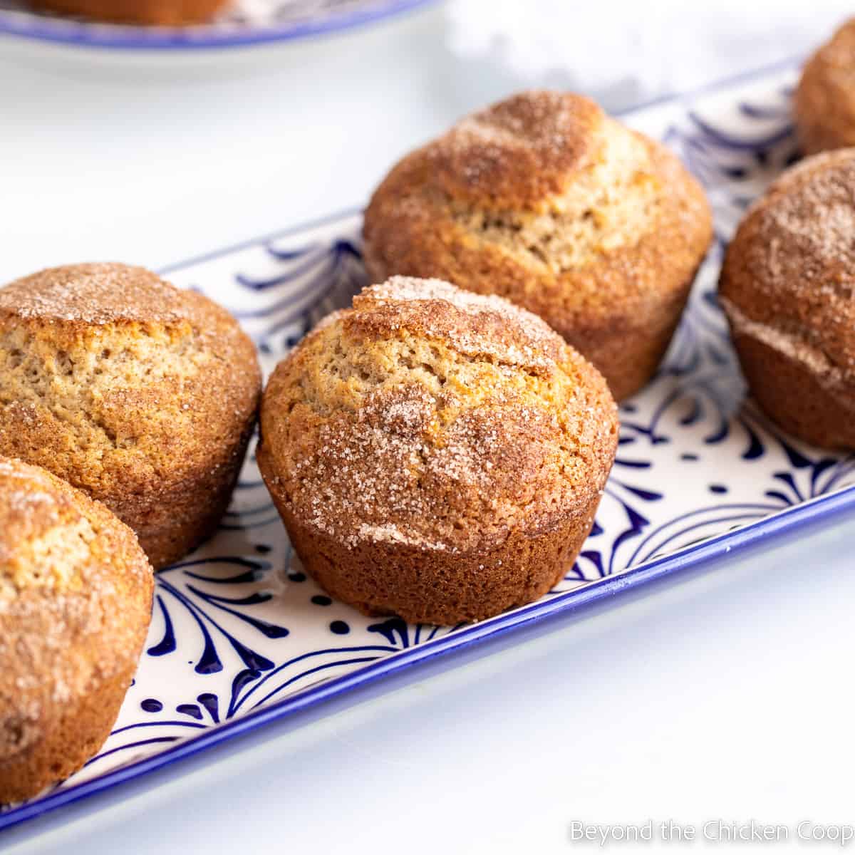 Muffins on a blue and white platter. 