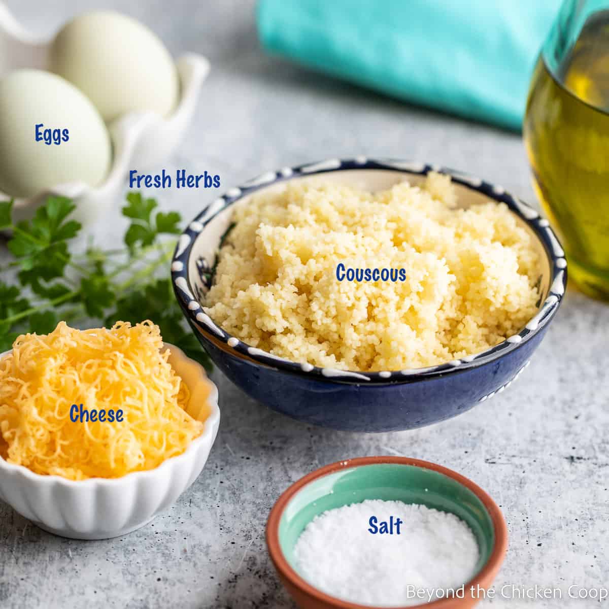 Bowls with couscous, cheese and salt. 