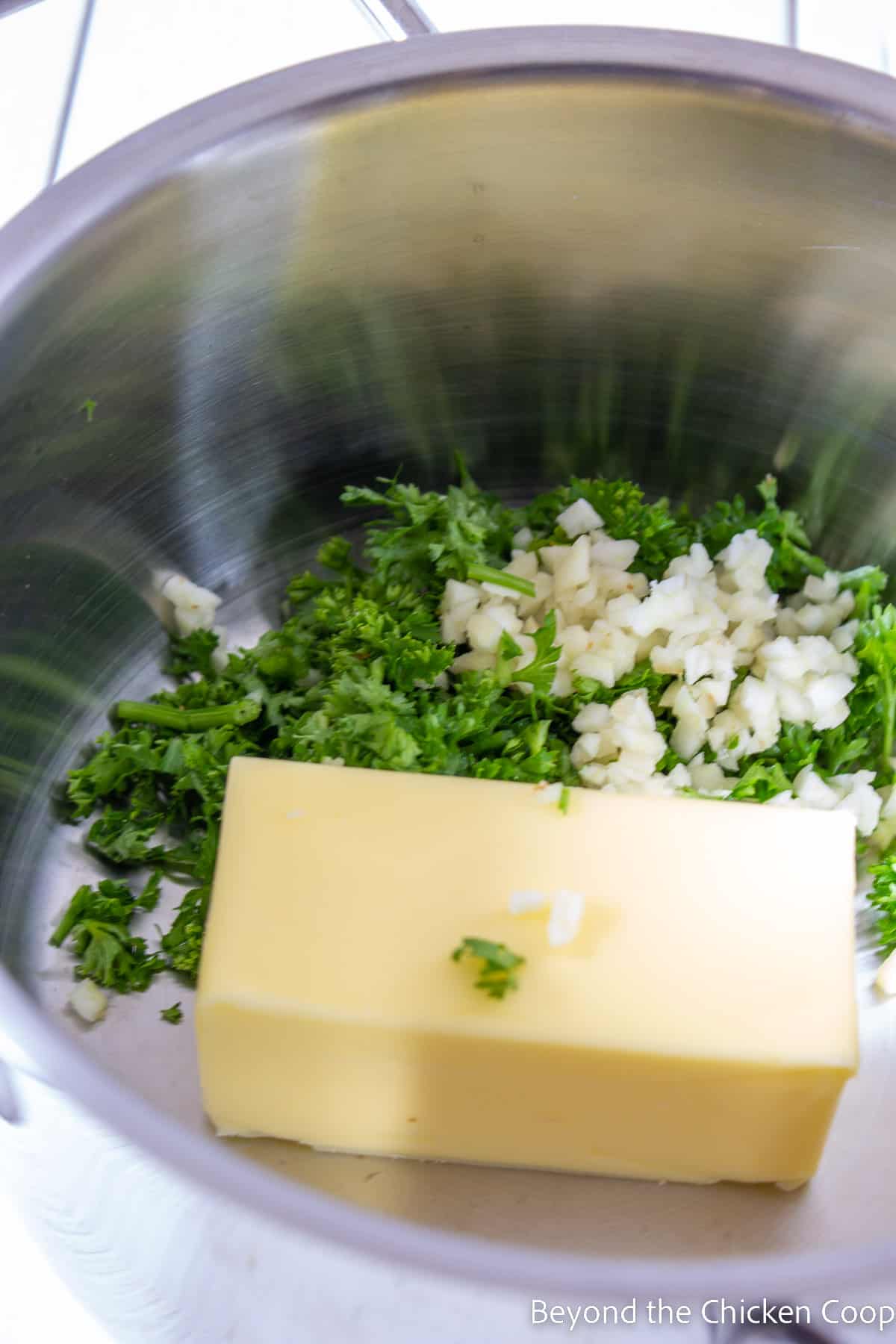 Butter, parsley and garlic in a saucepan. 