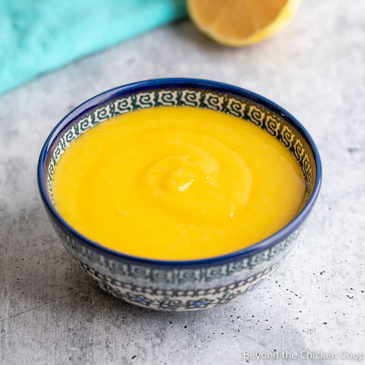 A bowl filled with lemon curd. 