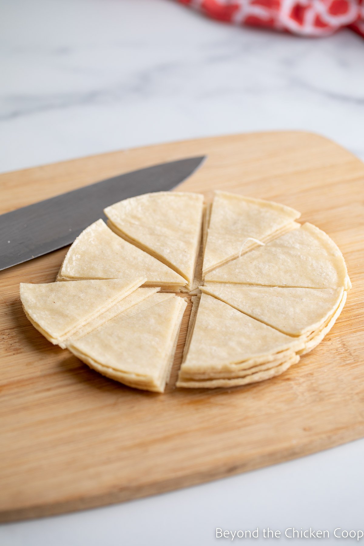 Cutting Tortillas into wedges.