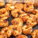 Seasoned cooked shrimp in a cast iron pan.