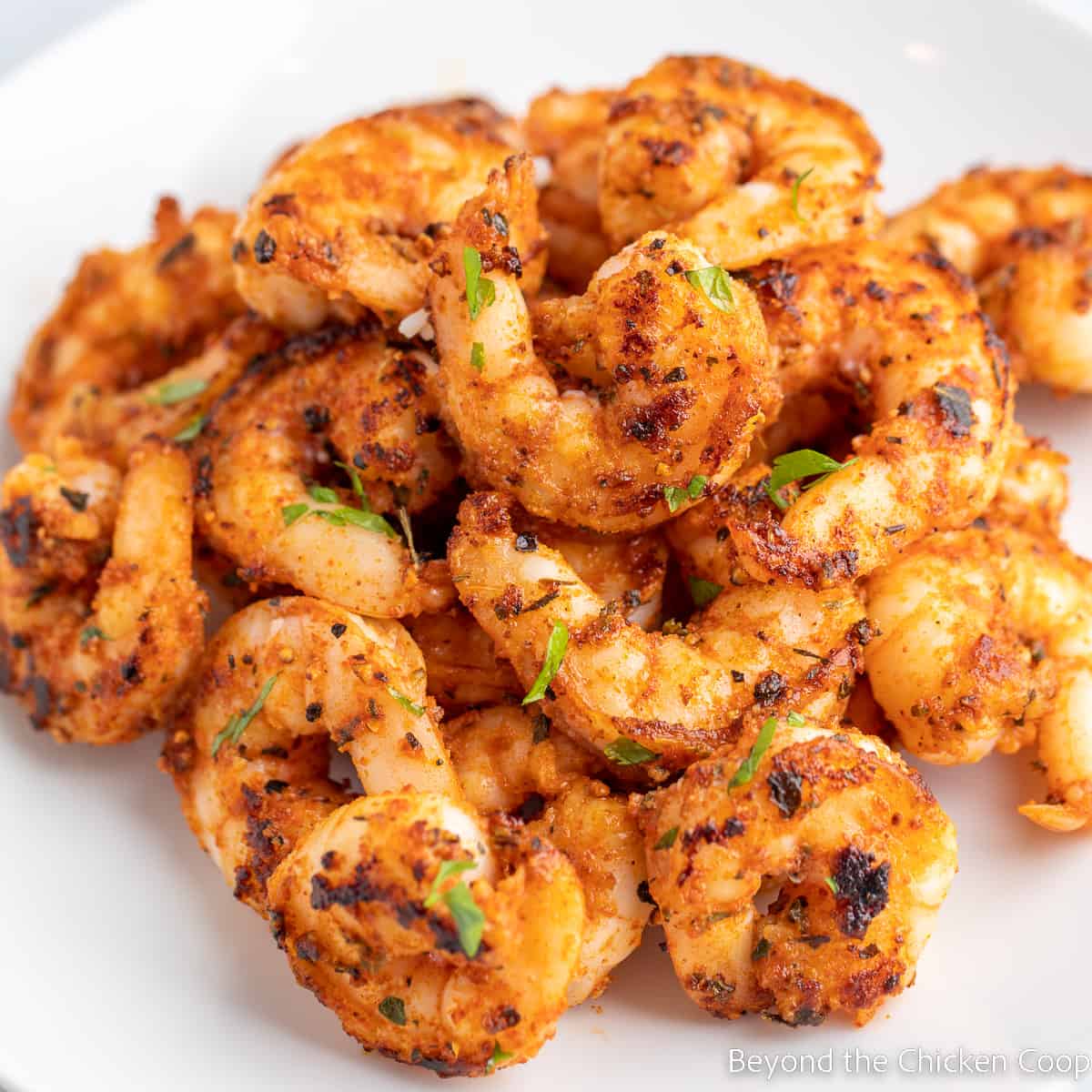 Cook shrimp with seasoning on a plate.