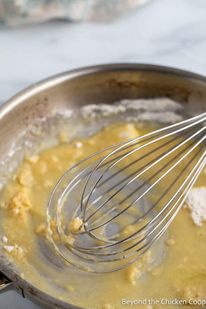 Browning the roux in a saute pan.