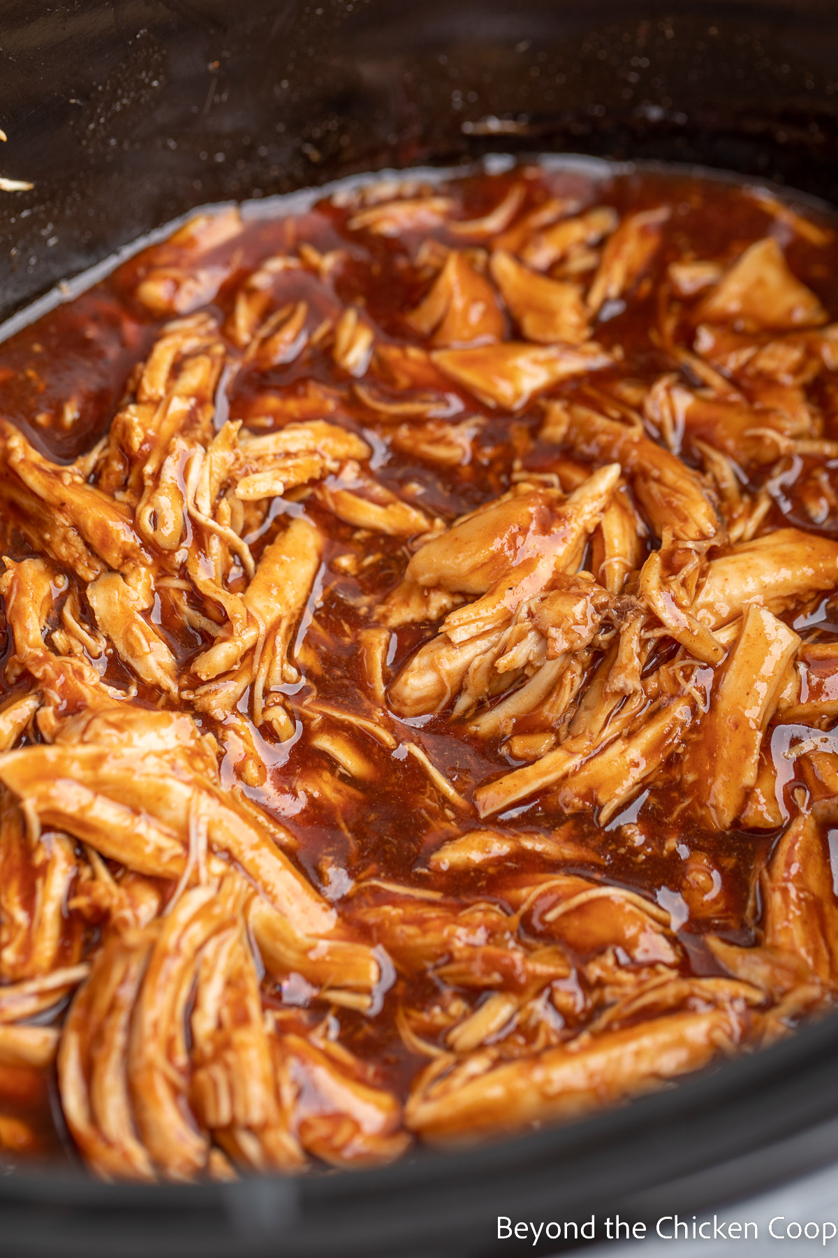 Shredded chicken with a barbecue sauce. 