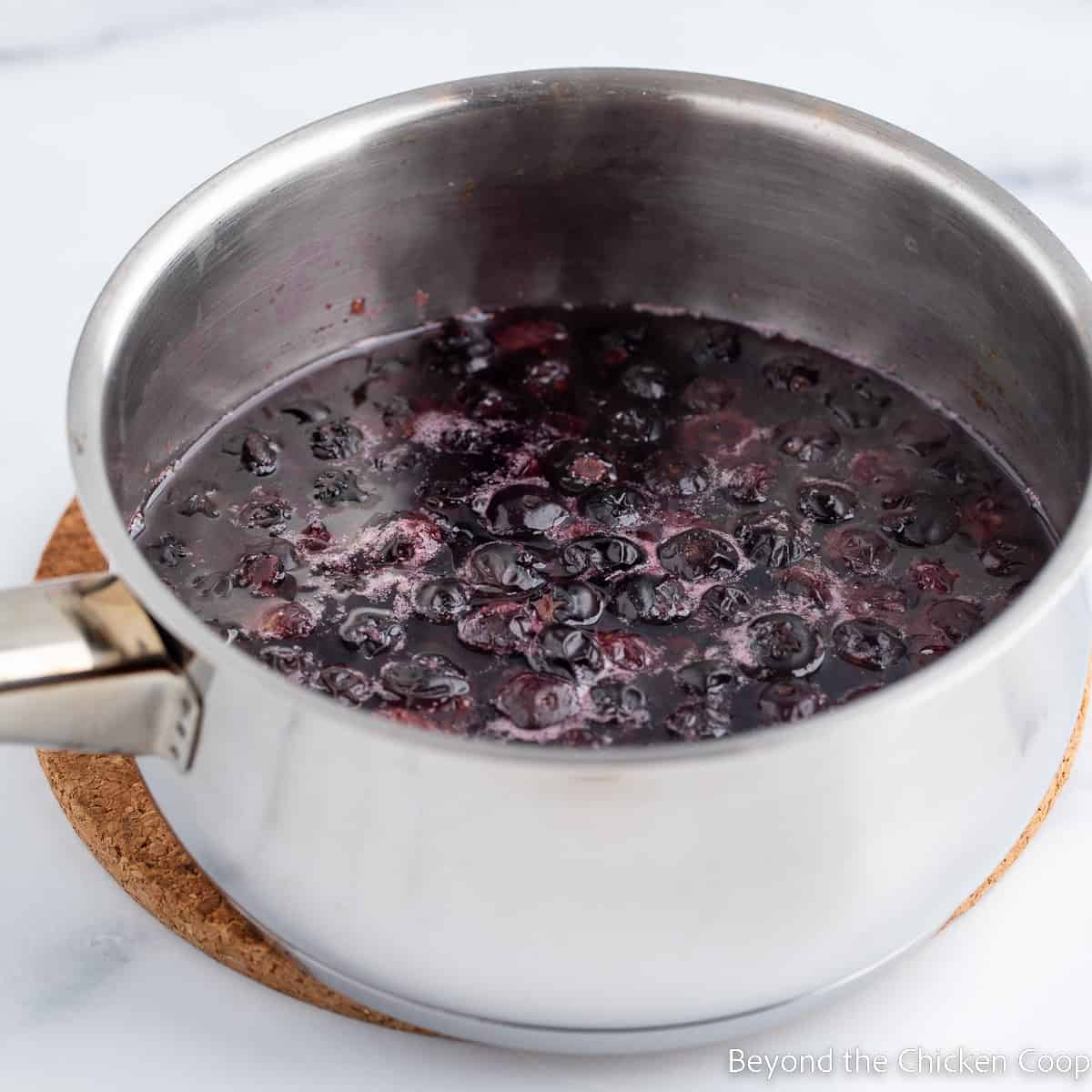 A saucepan with blueberries. 