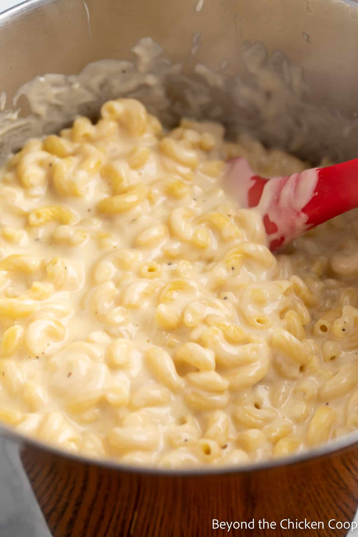 A pot with macaroni and cheese.