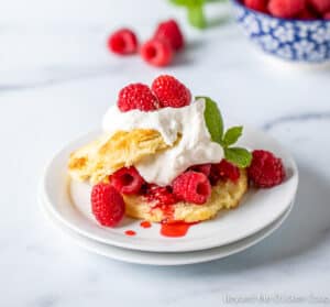 Shortcake filled with fresh raspberries and whipped cream.