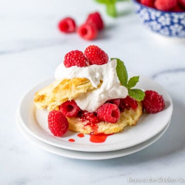 Shortcake filled with fresh raspberries and whipped cream.