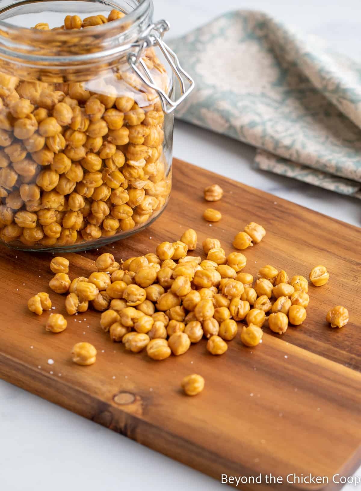 Crisp garbanzo beans on a wooden board. 