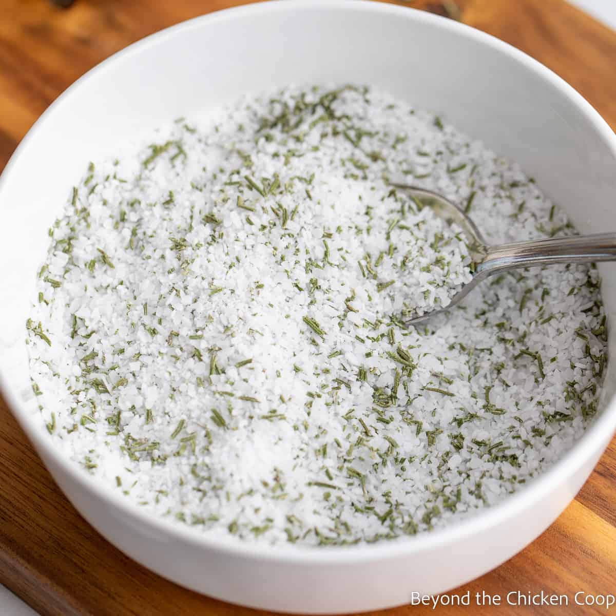 Rosemary and salt mixed together in a bowl. 
