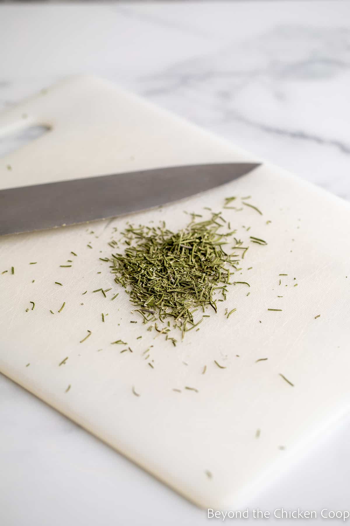 Chopping dried rosemary. 