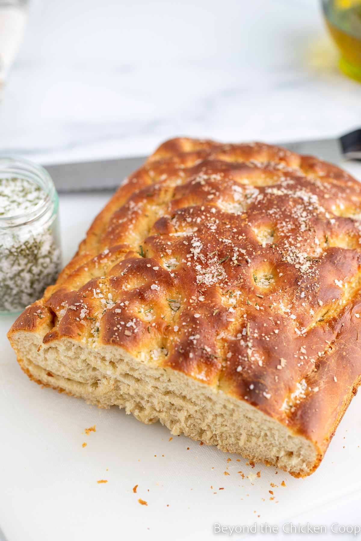 Focaccia bread topped with rosemary and salt. 