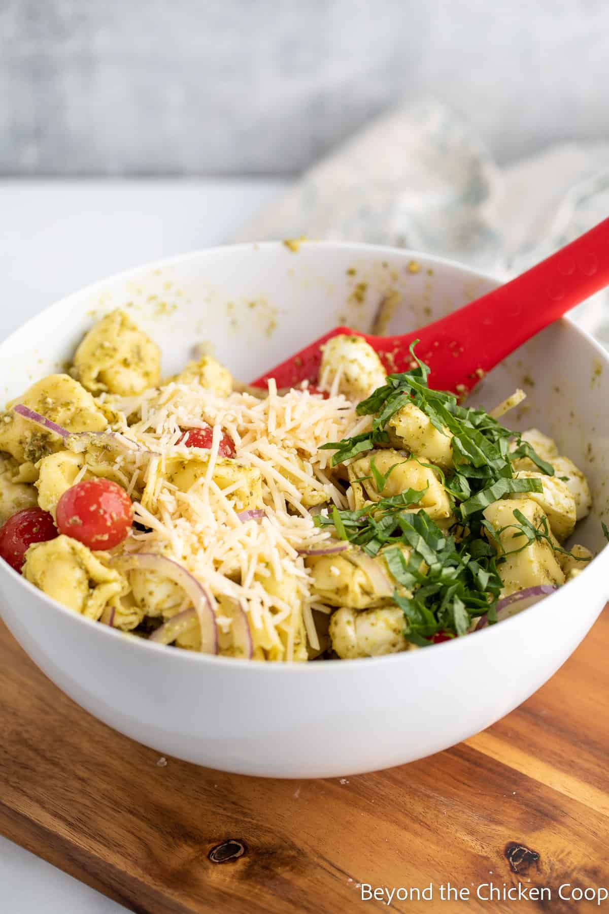 Fresh basil and parmesan on top of a salad. 