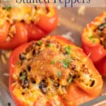 Stuffed red bell peppers in a baking dish.