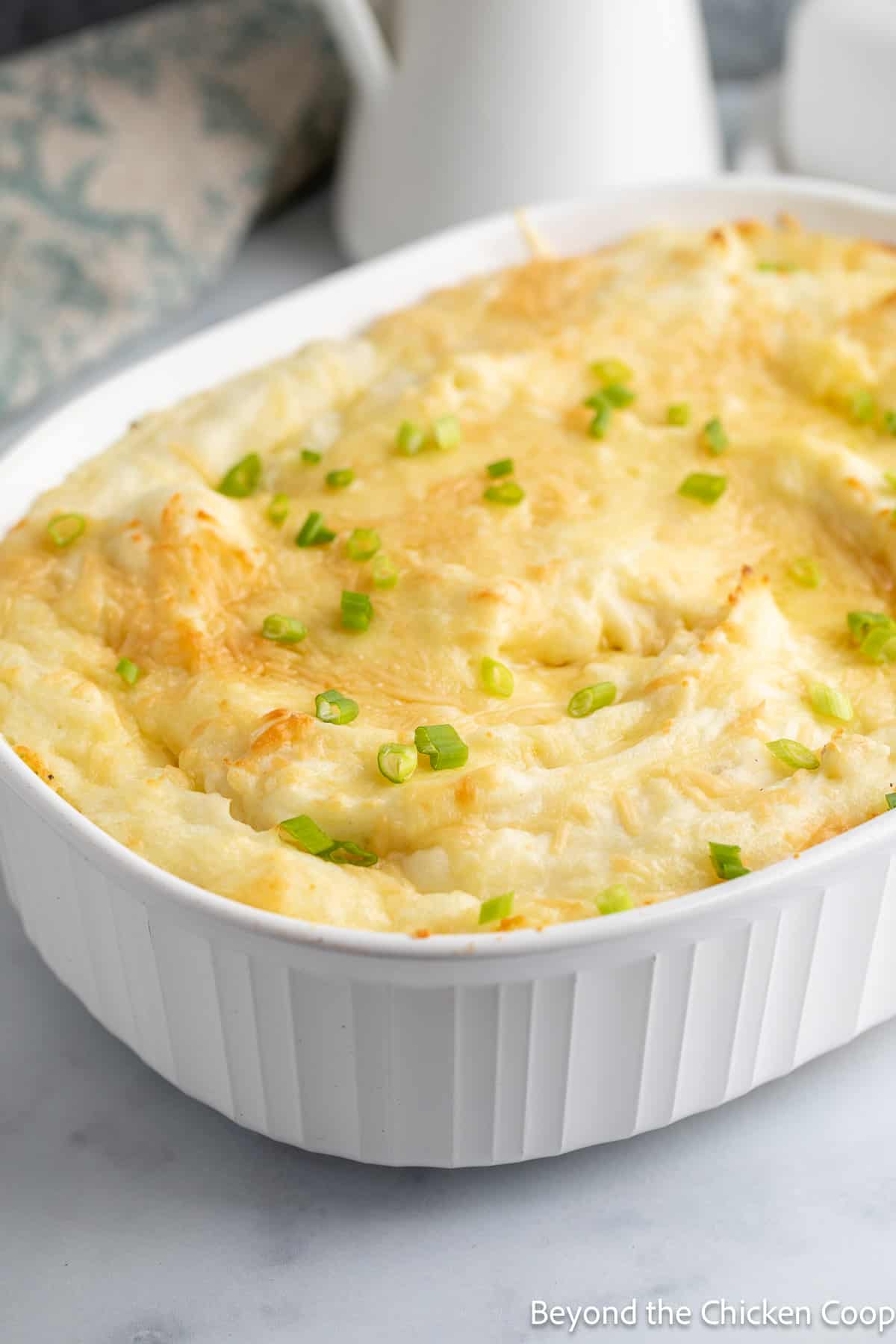 Mashed potatoes in a white casserole dish. 