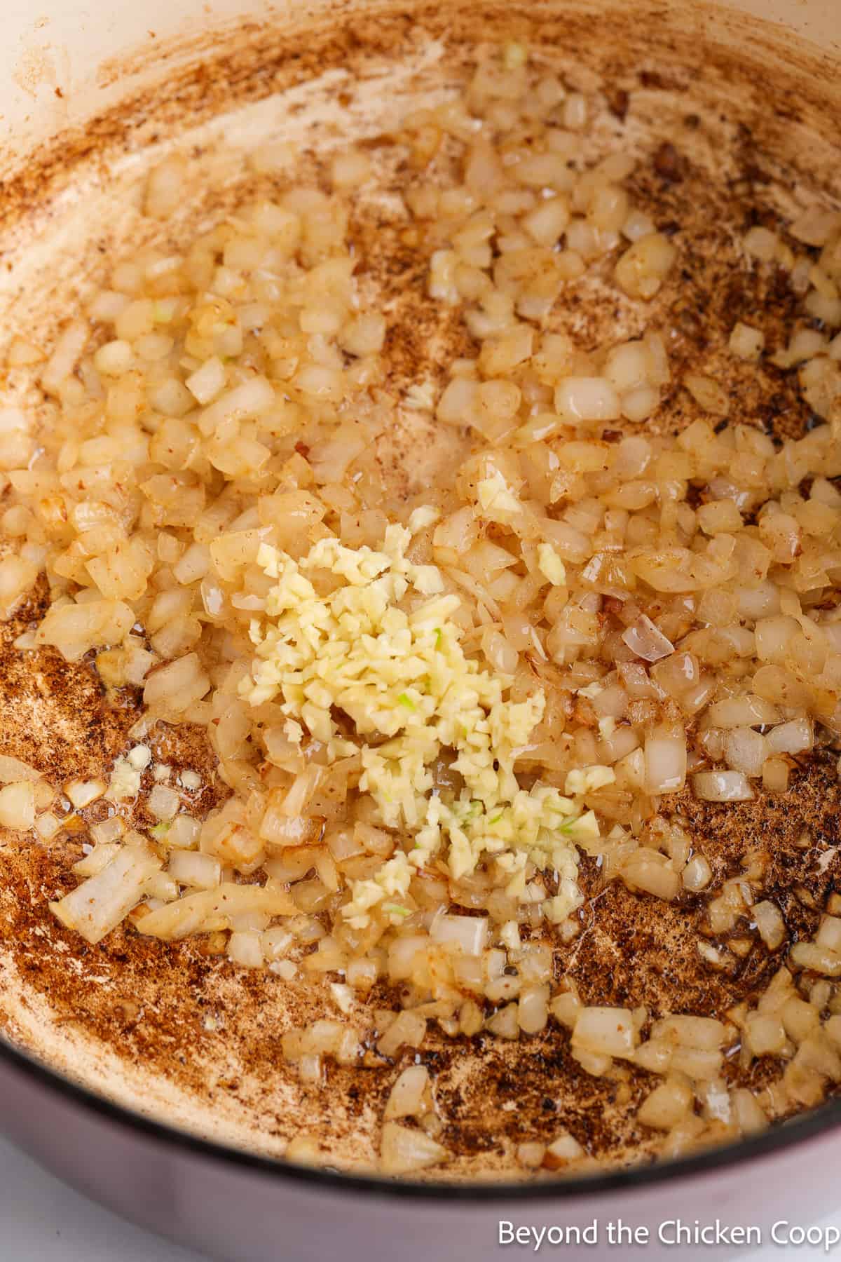 Sauteing onion and garlic in a large pot. 