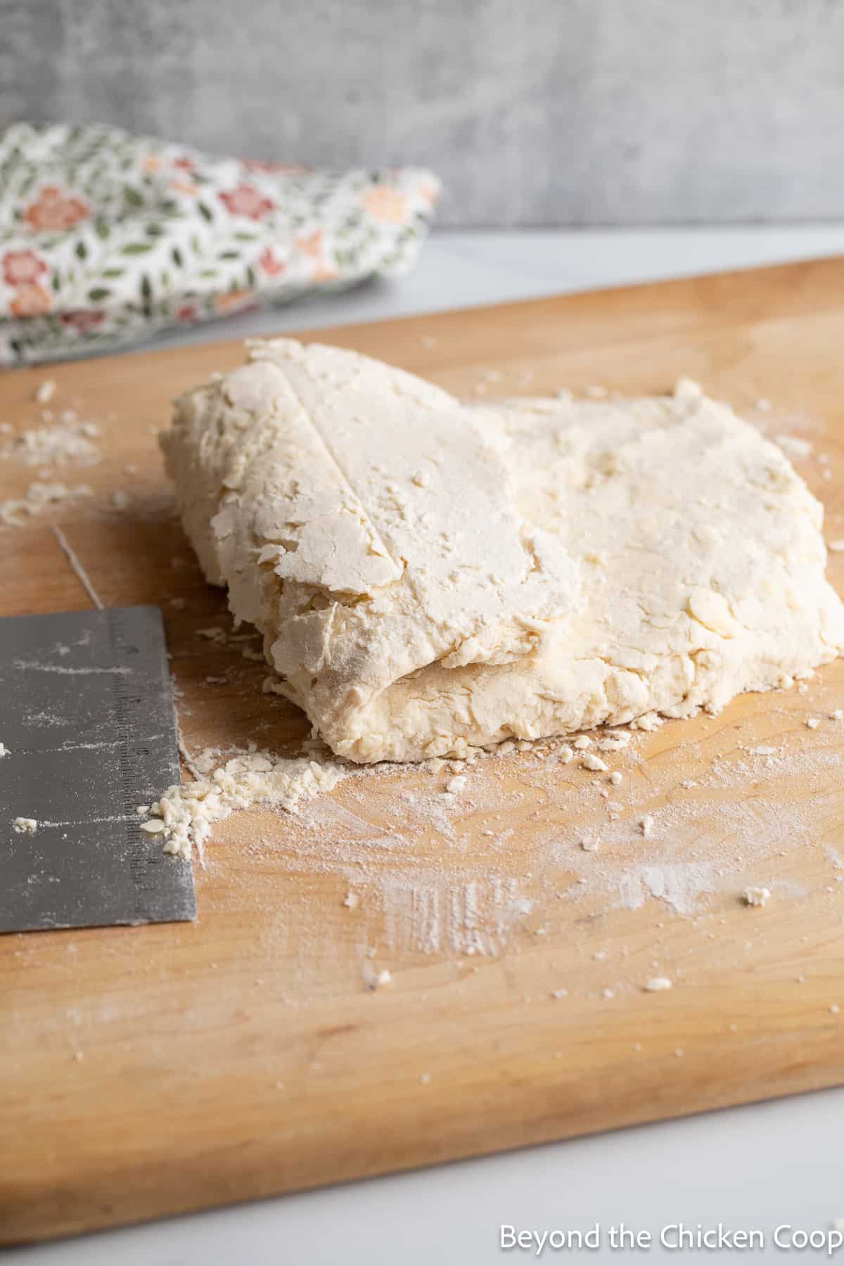 Folding dough into a letter fold. 