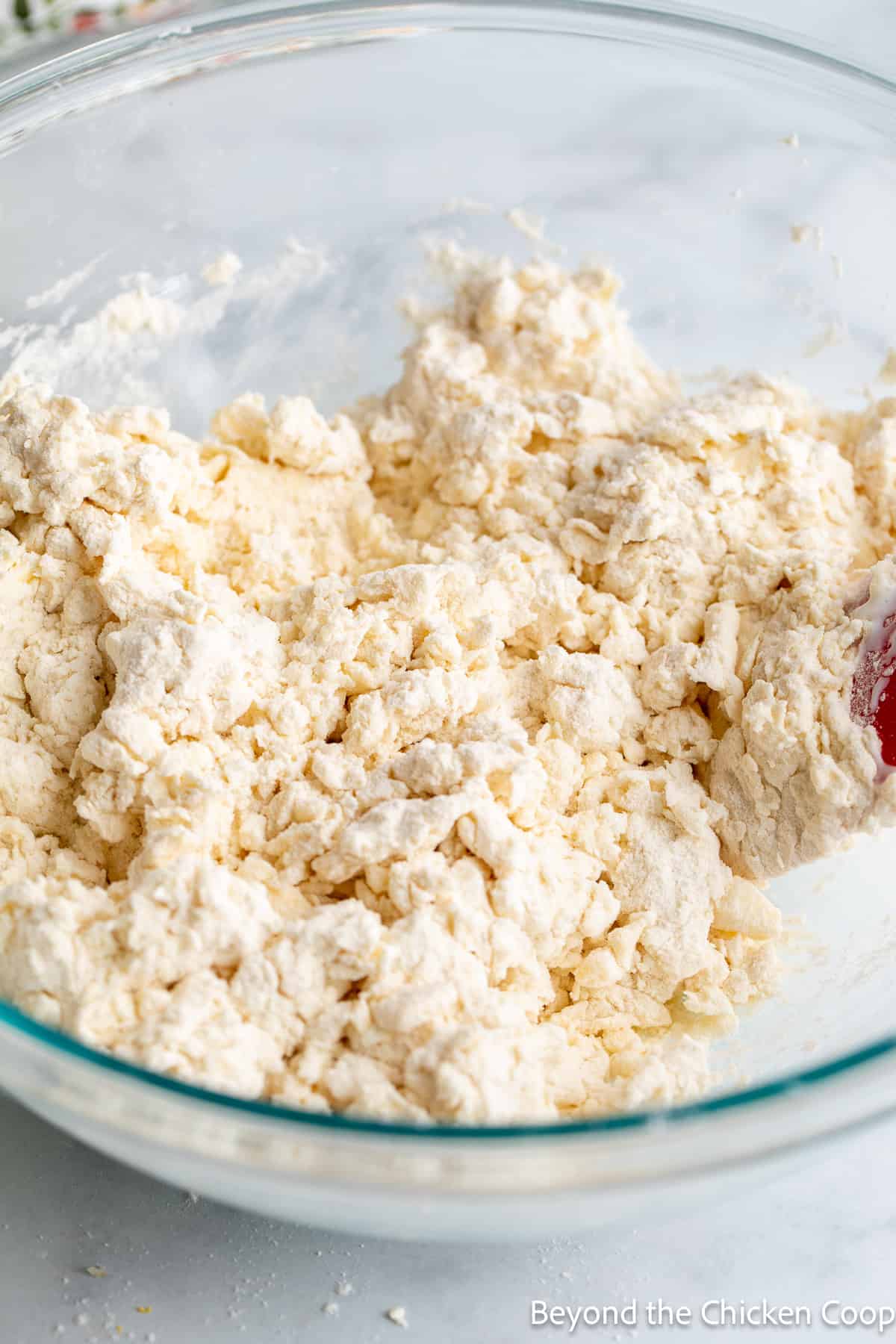 Biscuit dough in a glass bowl. 