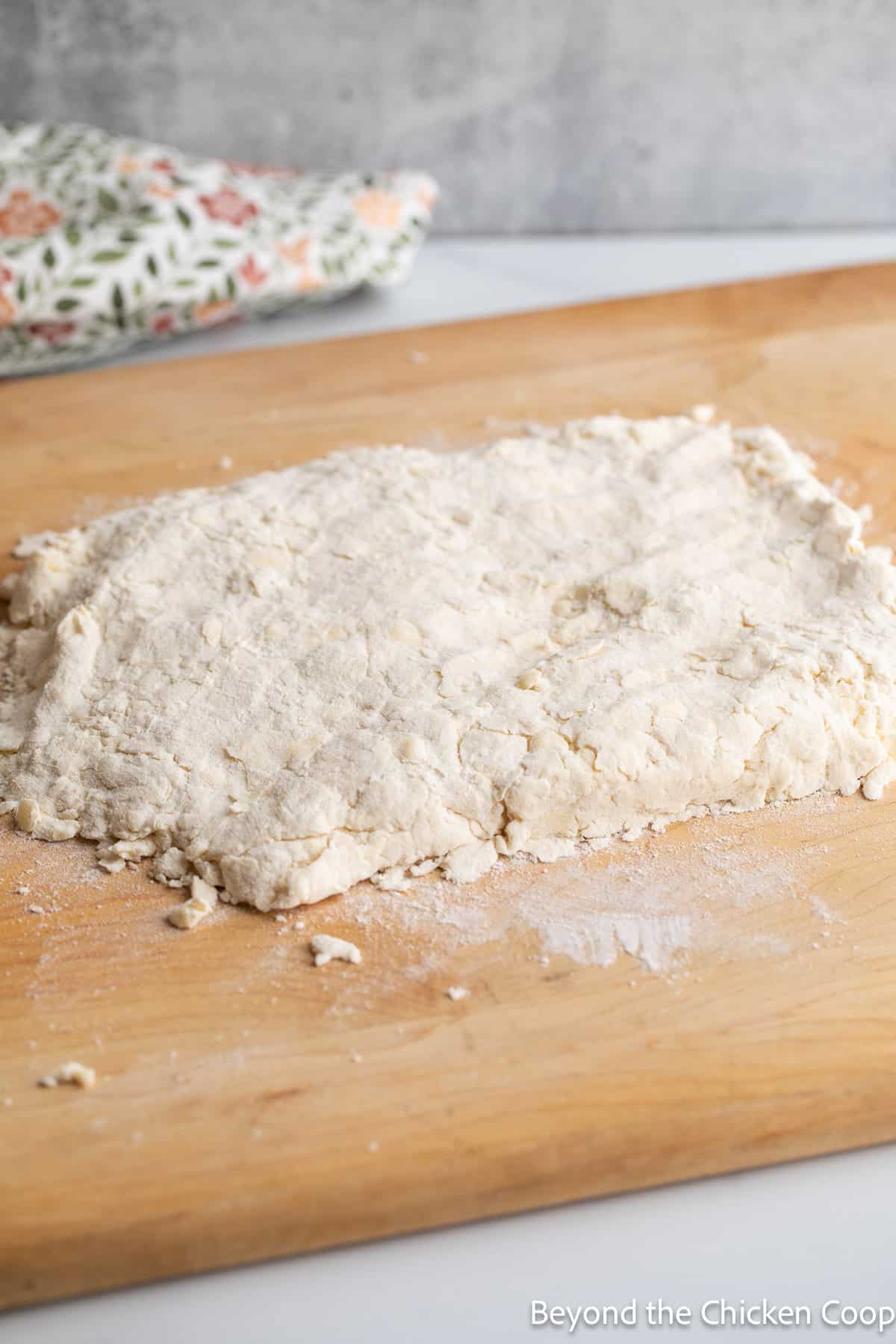 Dough on a wooden board. 