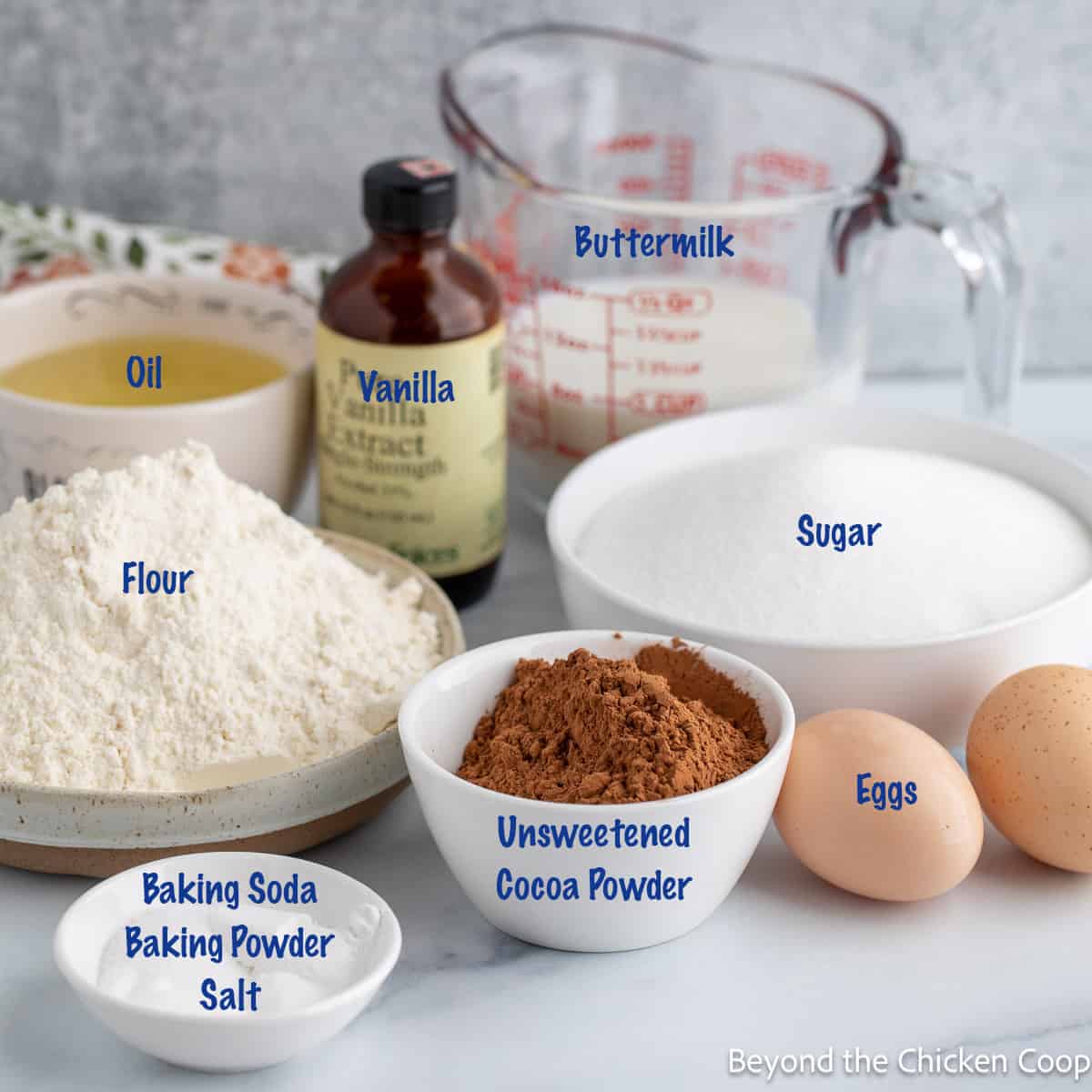 Ingredients in small bowls for making a cake. 