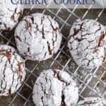 Chocolate crinkles on a baking rack.