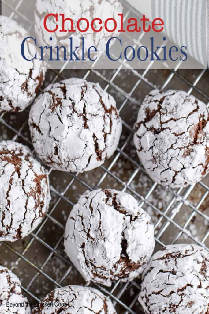 Chocolate crinkles on a baking rack.