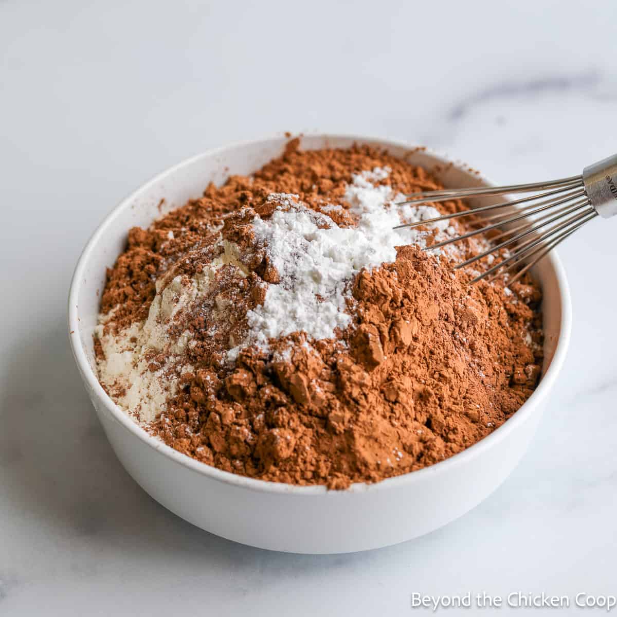 Cocoa powder with flour in a small bowl. 