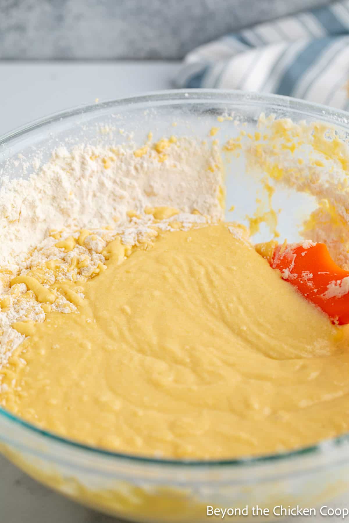 Cake batter in a large glass bowl. 