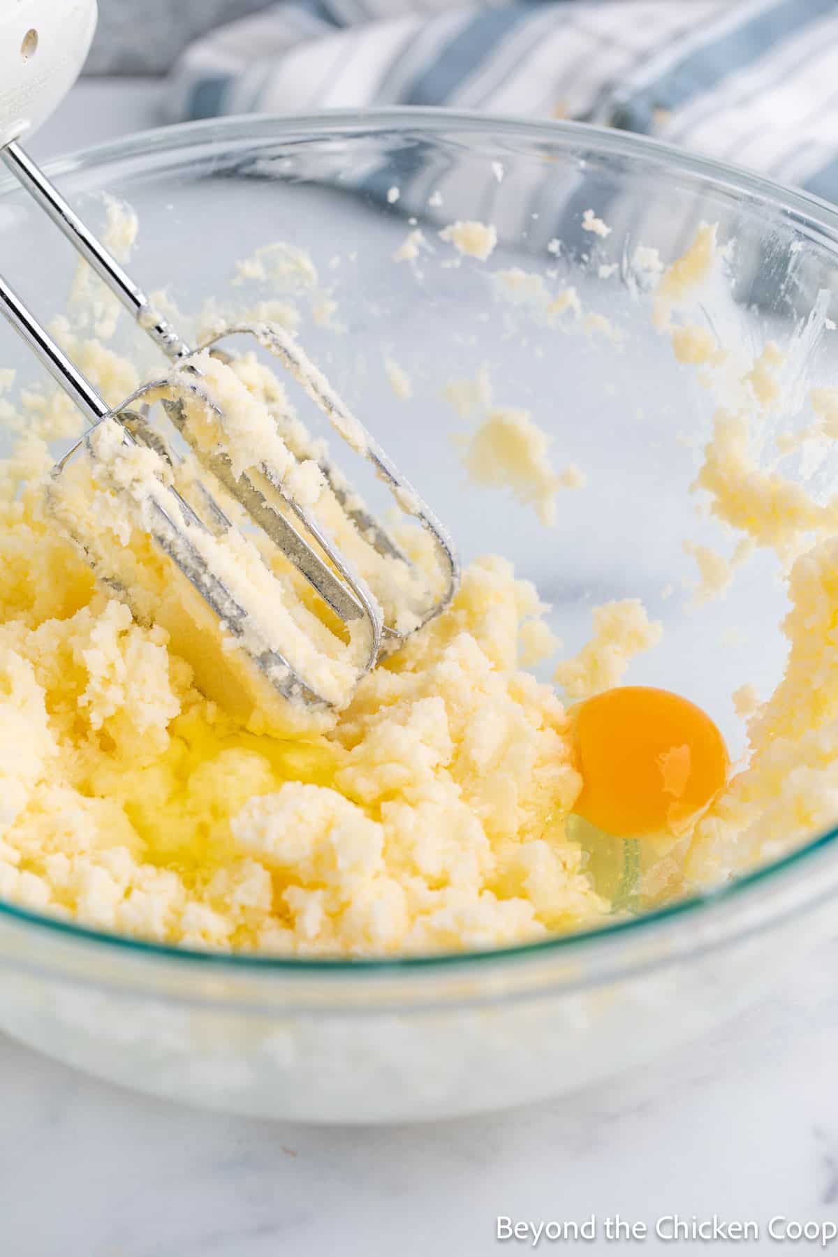 Mixing eggs into a batter. 