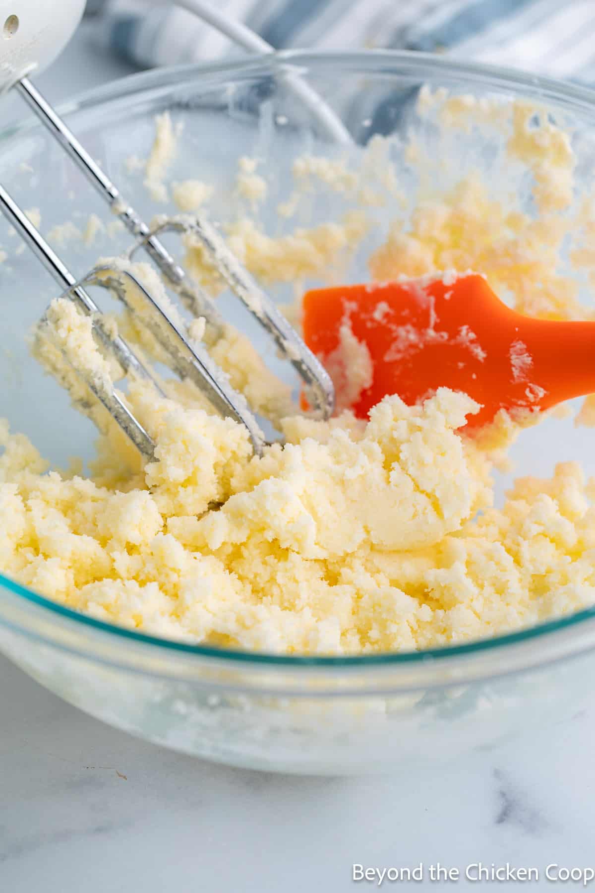 Creaming butter and sugar in a bowl. 