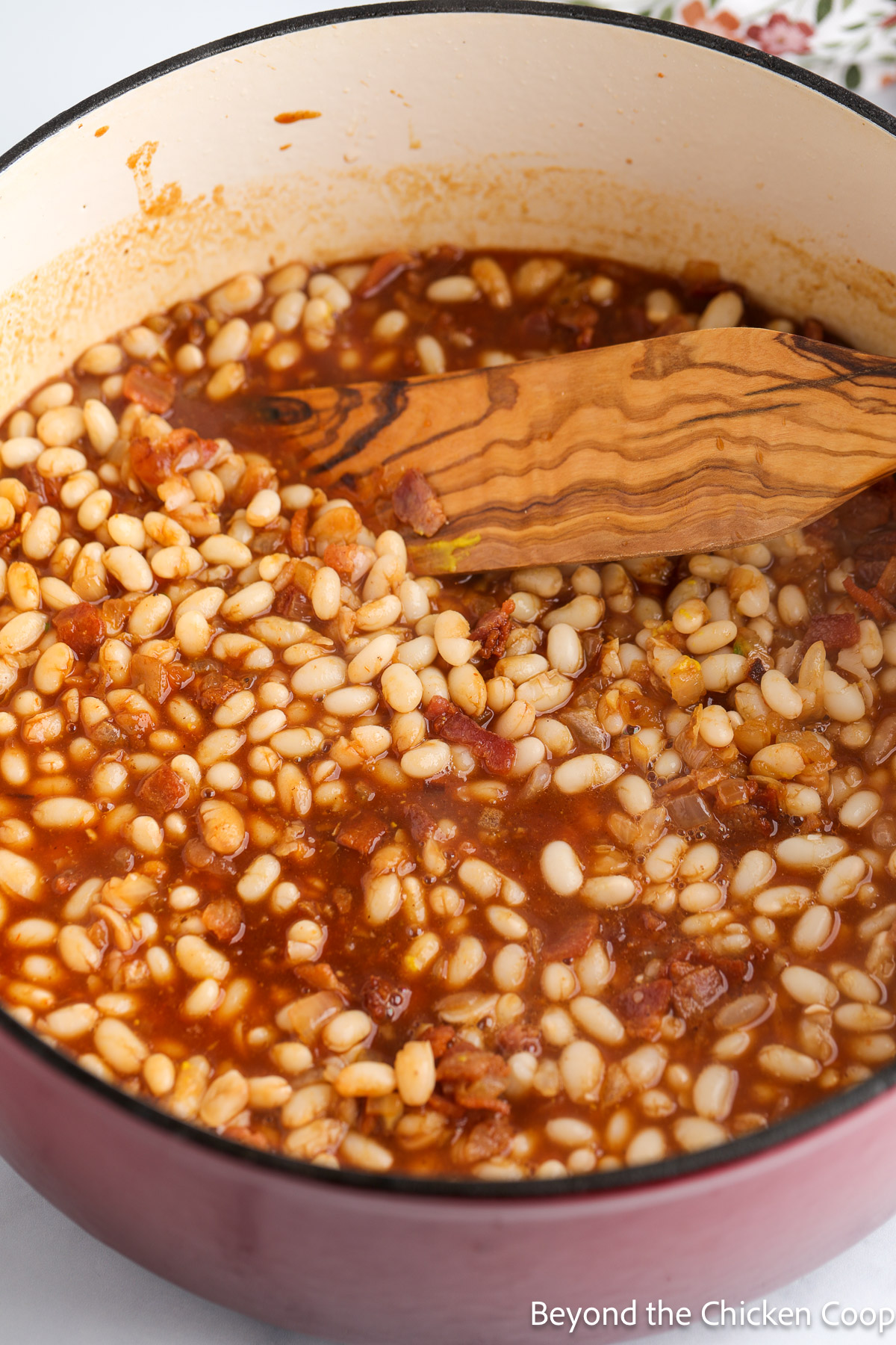 A pot of baked beans ready to go into the oven.