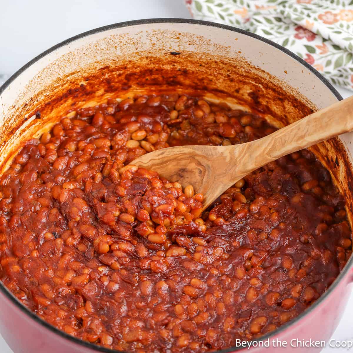 A large pot filled with baked beans.